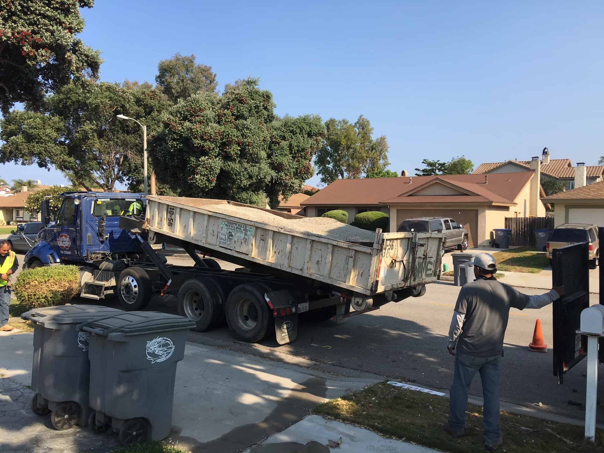 A VC Turf delivery of rolled turf and materials arriving at a job site