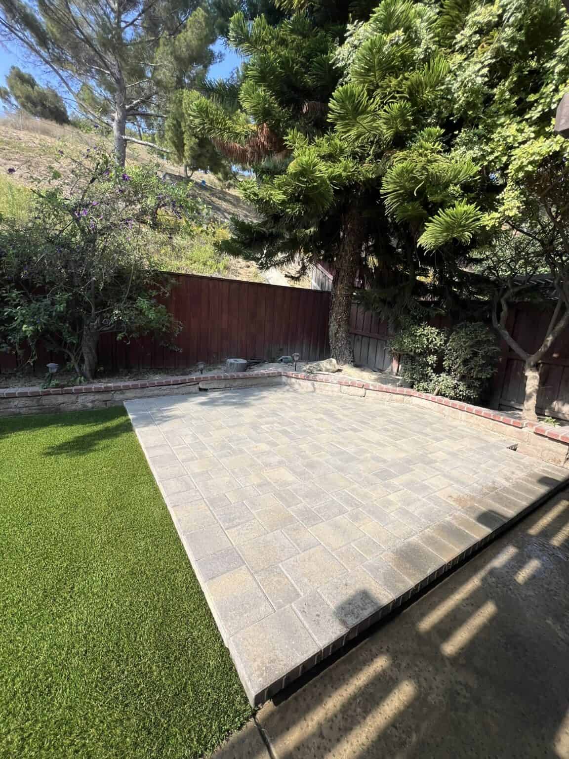 Backyard after the ground cover and hardscape work
