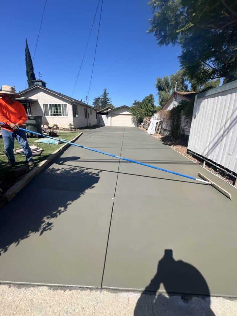 Finished broom-finish concrete driveway and walkway