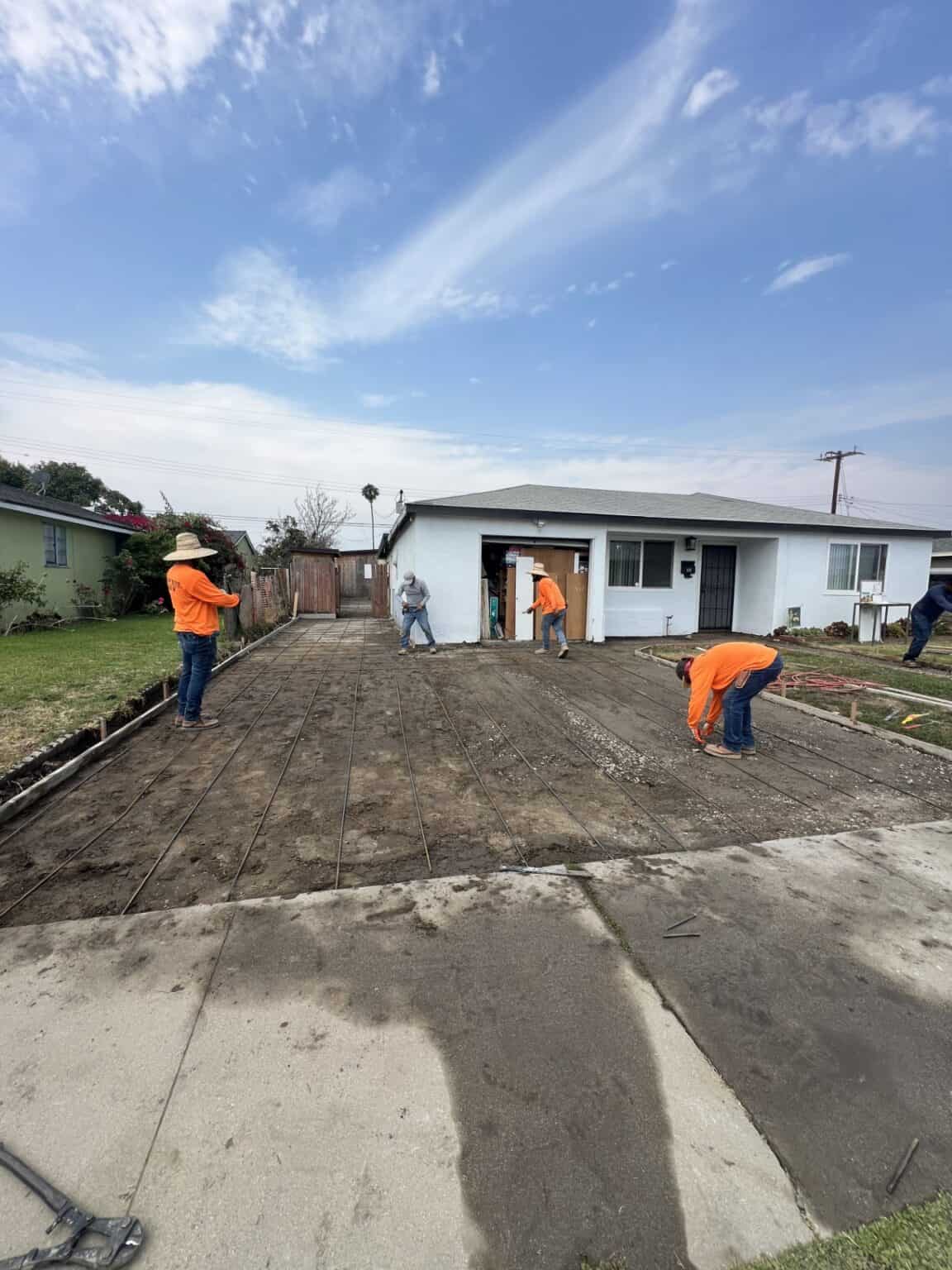 Old cracked concrete driveway before replacement