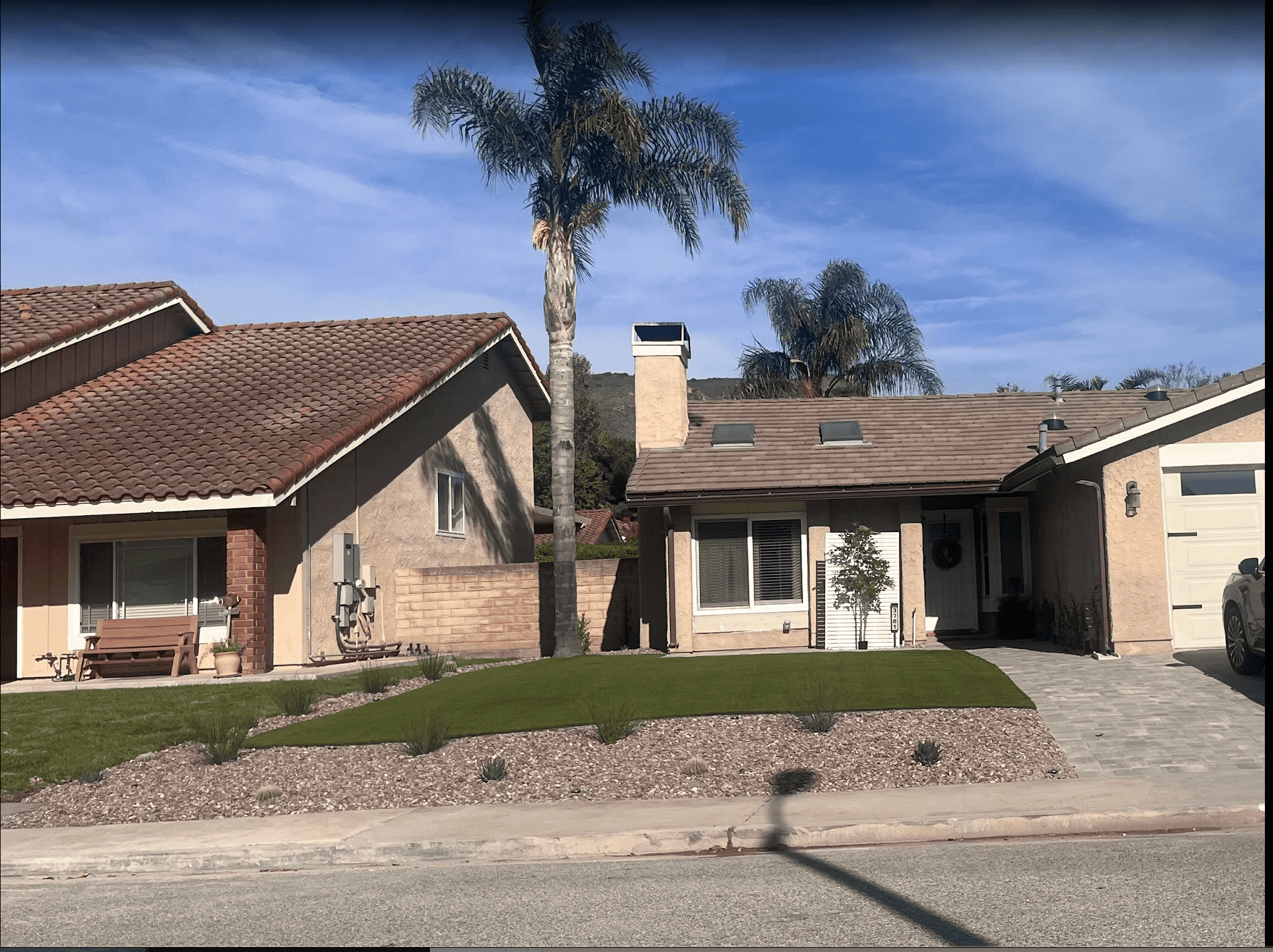 Finished front yard remodel with artificial turf and new hardscape