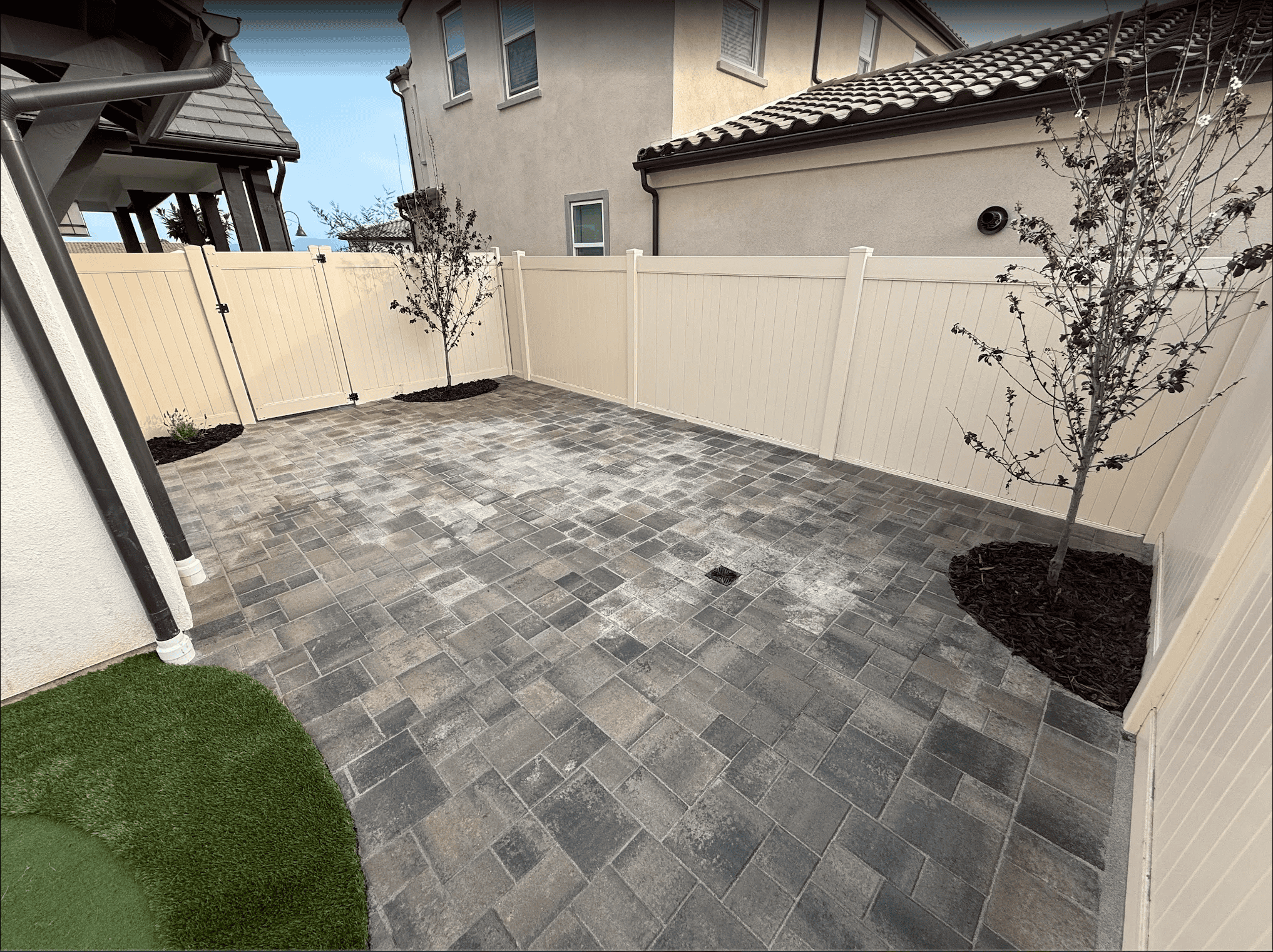 Interlocking paver patio with a seating area