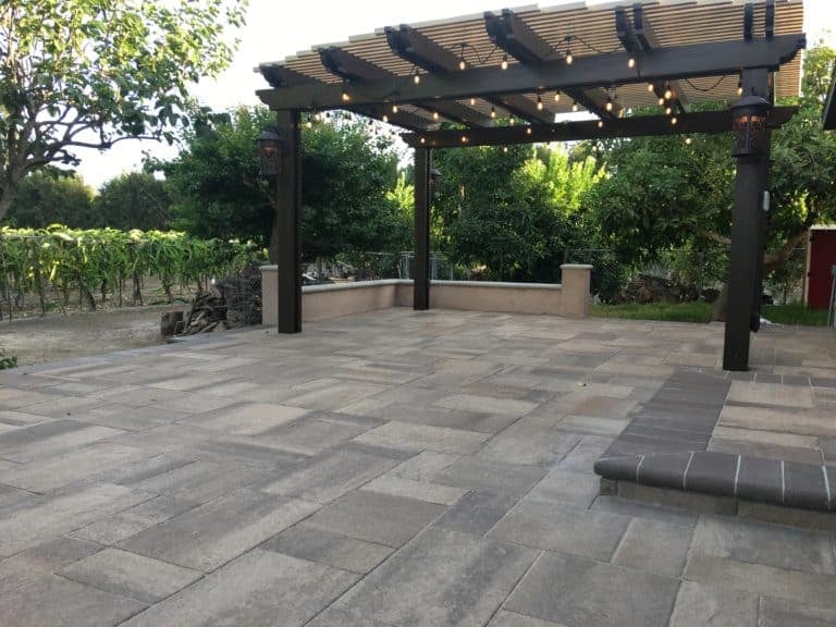 Interlocking pavers laid in a tight pattern with a contrasting border, installed by VC Turf